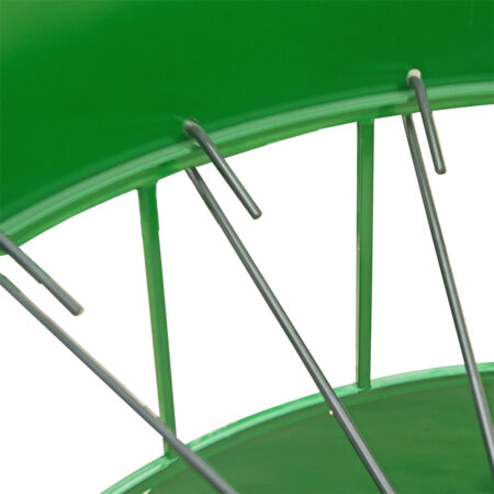 Close up shepherds hook hanging on round bale feeder