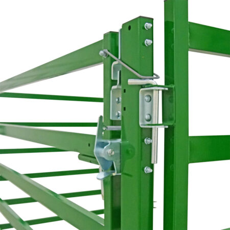 Close up of heavy duty no bow cattle gate angled side view and enhanced two way slam latch connected to a cattle corral panel