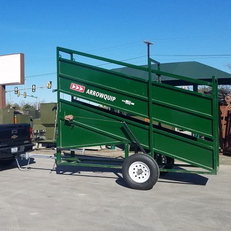 Portable cattle loading chute being towed to a new location