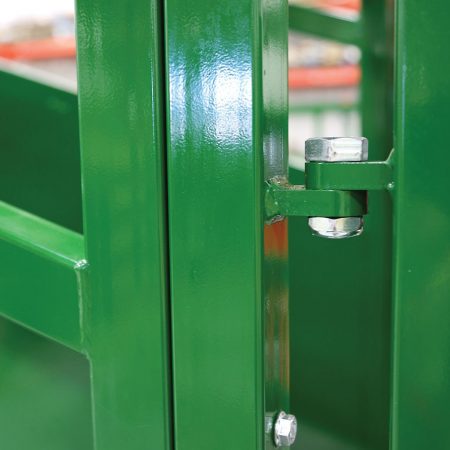 Close-up of palpation cage installation on cattle loading ramp