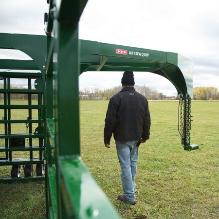 Man walking under front hitch