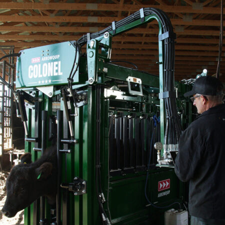 Rancher using hydraulic controls on Colonel heavy-duty chute